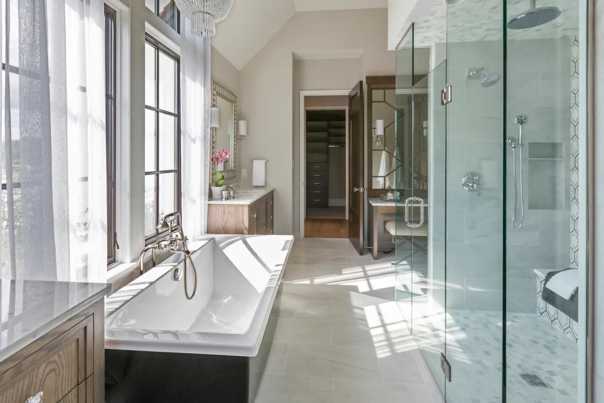 Luxury ensuite bathroom renovation with freestanding soaker tub by Leo Constra