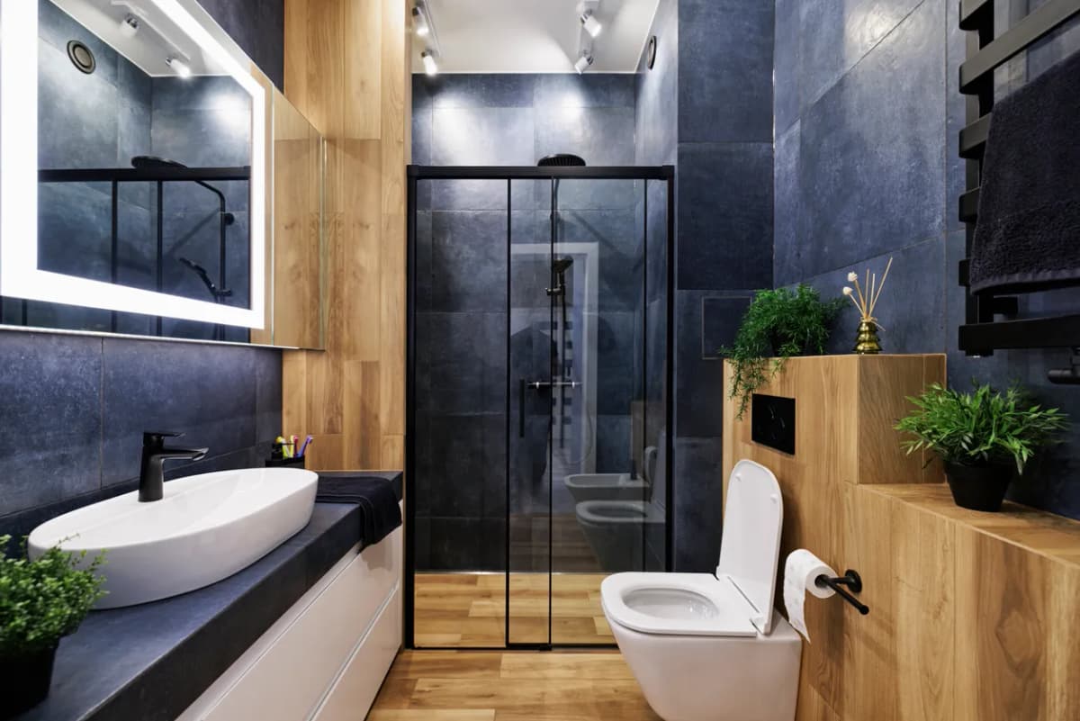 Large-format porcelain tile flooring installation in contemporary bathroom in Toronto
