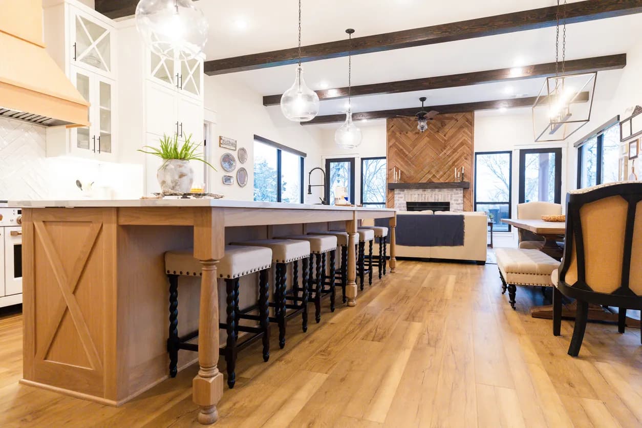 Open concept kitchen and living room renovation with structural beam in Toronto by Leo Constra